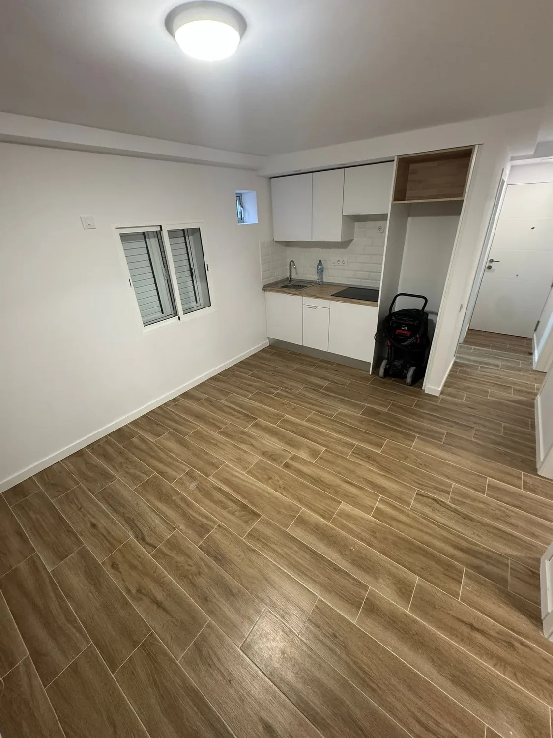 Salón reformado del proyecto Escaleritas, interiores cálidos